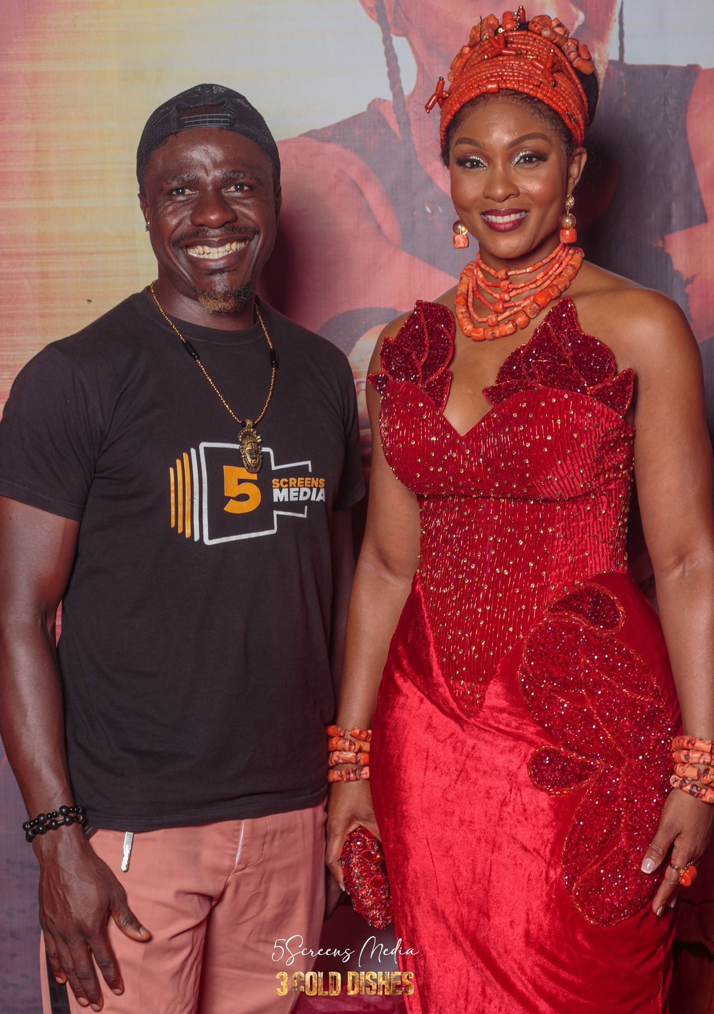 Edafe Dmouthpiece at 3 Gold Dishes premiere with guest in traditional attire