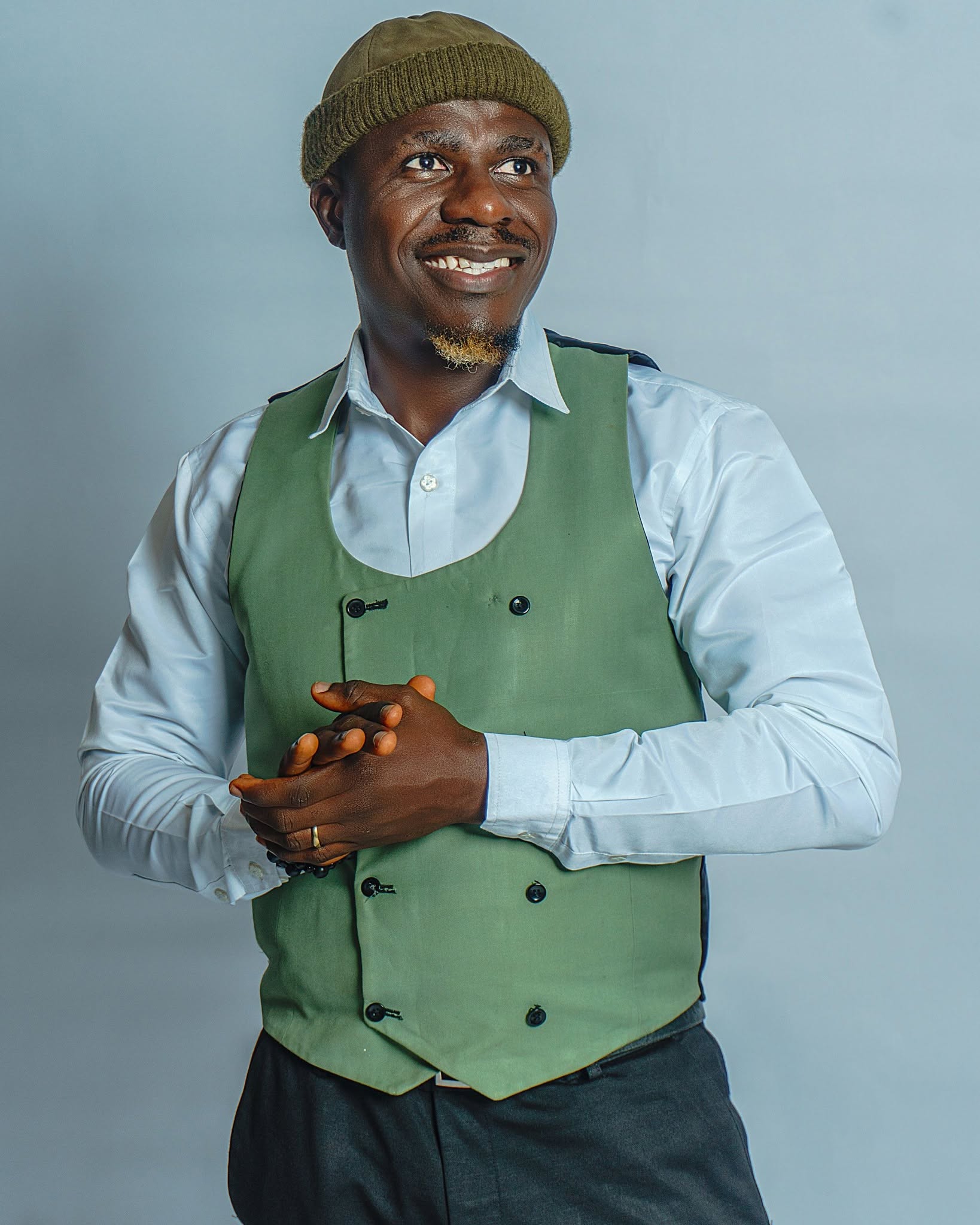 Edafe Dmouthpiece, warm smiling studio portrait